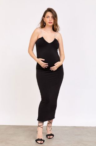 	אישה לובשת שמלת קריסטן להריון שחור של אבישג ארבל